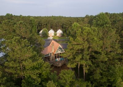 And overhead view of tree-covered buildings.