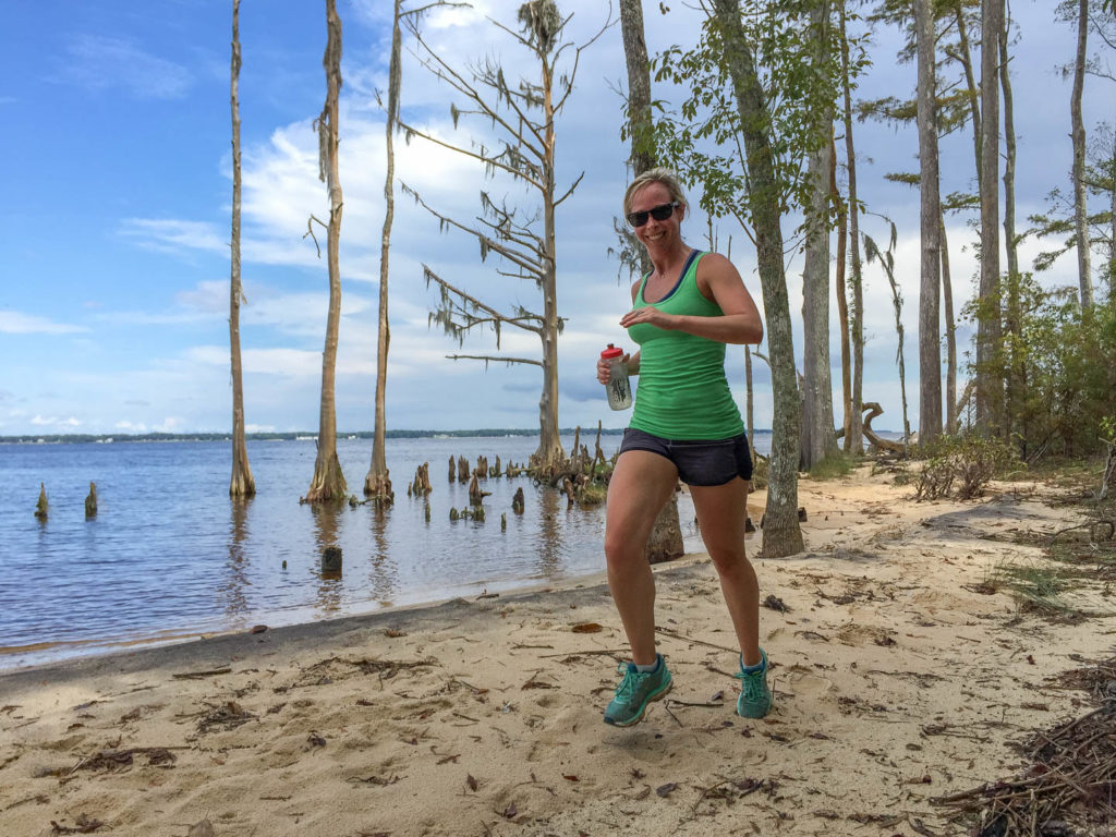 Julie running the Neusiok Trail in the Croatan National Forest just across the river from Arlington Place.